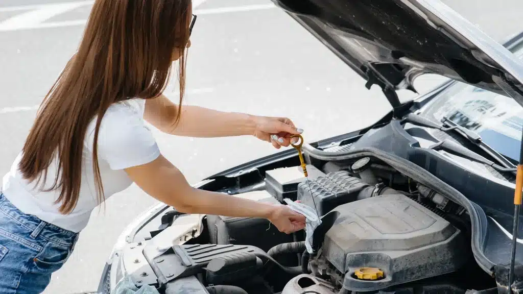 Female checking the engine oil - Vehicle-Maintenance-Courses-Gold-Coast Qld